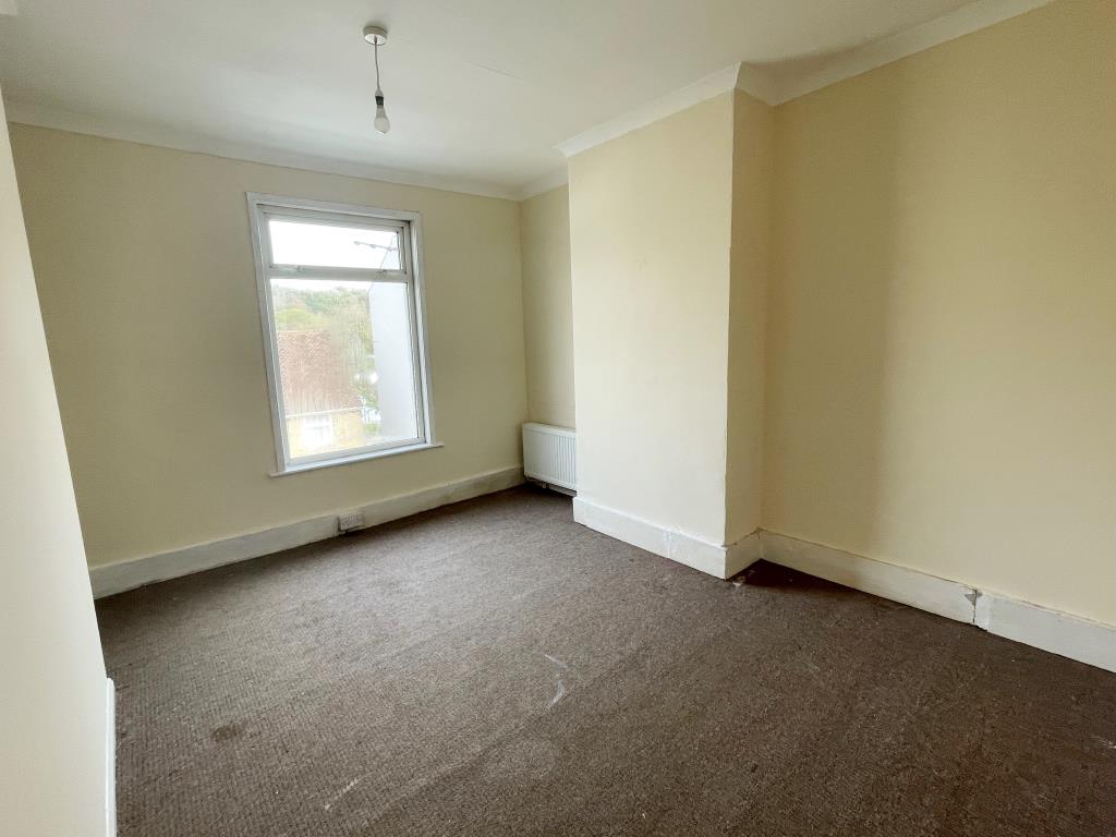 Lot: 2 - MID-TERRACE HOUSE WITH POTENTIAL - Bedroom 1 with window and chimney stack